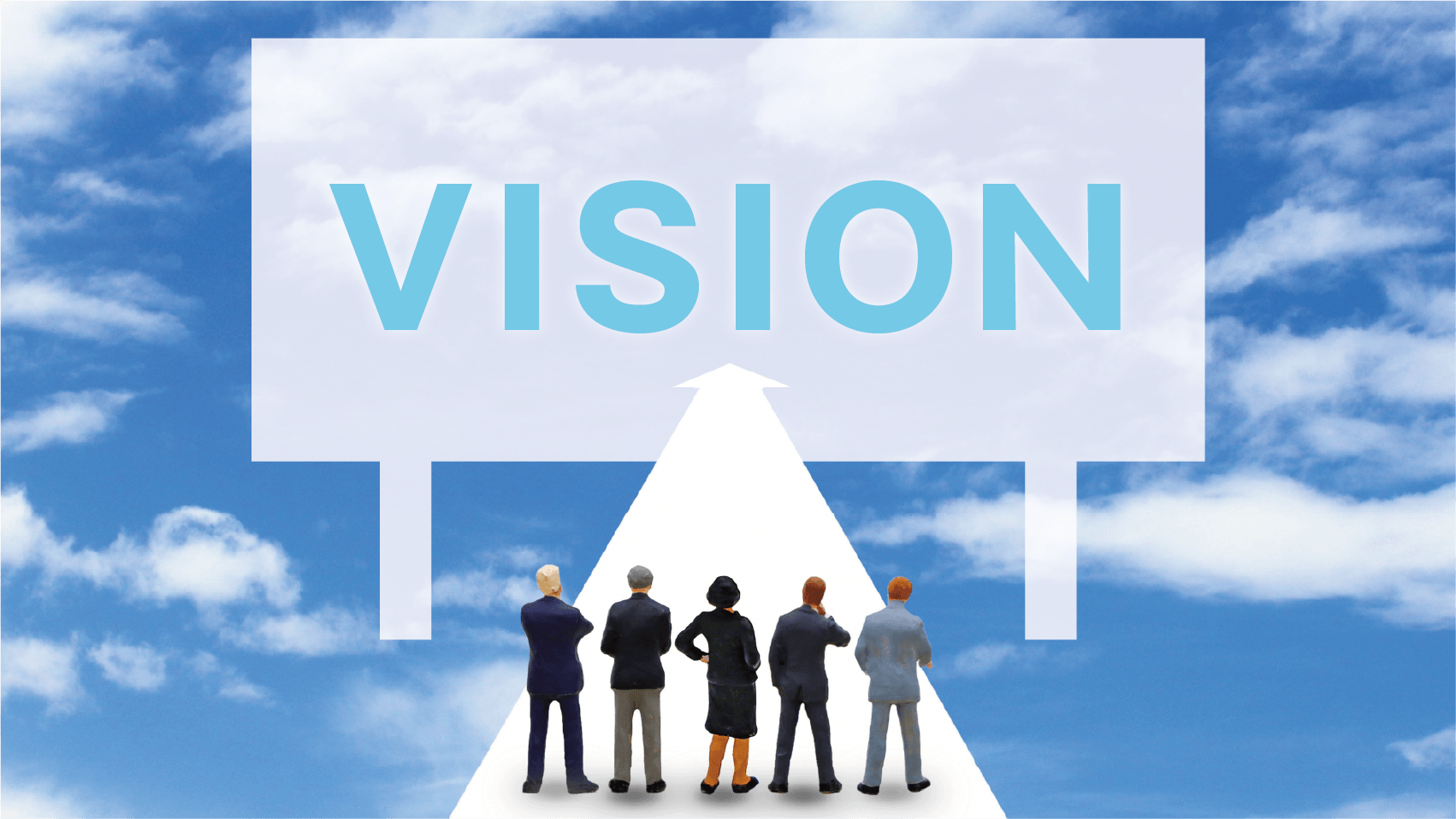 イメージ画像:VISIONと書かれた野立て看板に向かって社員たちが未来を想像しているイメージ図